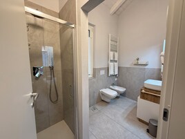 Comfort Condo | Bathroom | Shower, hair dryer, towels, soap