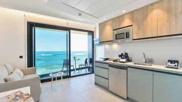 Deluxe Studio, Balcony, Beach View | In-room safe, desk, laptop workspace, blackout drapes