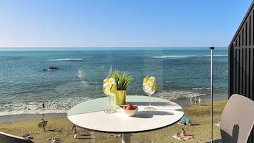 Deluxe Studio, Balcony, Beach View | In-room safe, desk, laptop workspace, blackout drapes
