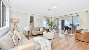 Living area - ChrisTony 3 Bdrm Waterfrnt Cottage (Lake Munmorah)