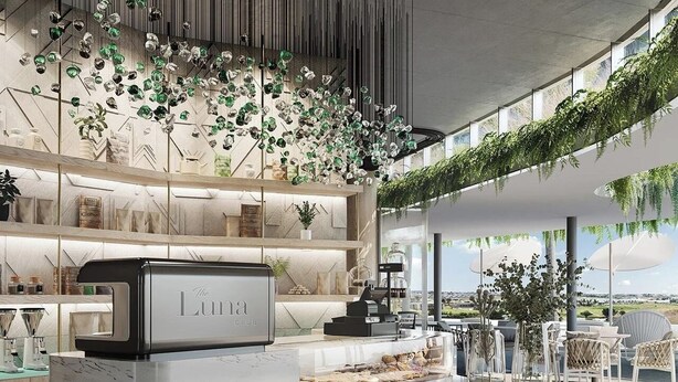 A modern hotel lobby with a reception desk, indoor plants, and a view of the outdoors. - Lux Ellipse Galelileo (Midrand)
