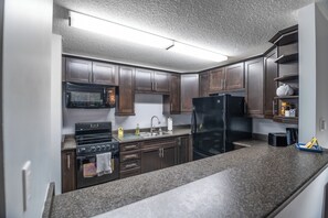 Fridge, microwave, oven, stovetop - #201 Lower Garden View Suite at Shorewater Resort, Qualicum Beach (Qualicum Beach)