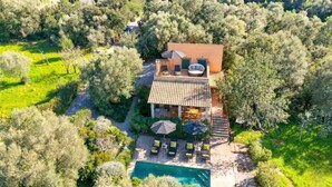 An aerial view of a villa with a swimming pool, outdoor seating, and a garden. - Son Roig - Campanet more than a holiday finca (Campanet)
