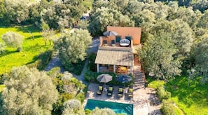 An aerial view of a villa with a swimming pool, outdoor seating, and a garden. - Son Roig - Campanet more than a holiday finca (Campanet)