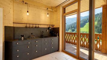 Fridge, stovetop, dishwasher, coffee/tea maker