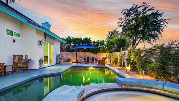 A swimming pool with a hot tub, outdoor seating, and a patio area. - Casa Solara - A Ryson Property (Palm Springs)