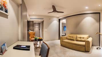 Premium Room | Living area | 24-inch LCD TV with satellite channels
