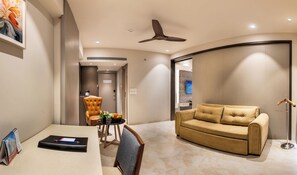 Premium Room | Living area | 24-inch LCD TV with satellite channels - SkkyLight Lords Inn (Nanded)