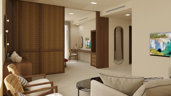 A modern living room with a sofa, a wicker chair, a small table, and a decorative wall panel. - Agali Hotel Milos (Milos)