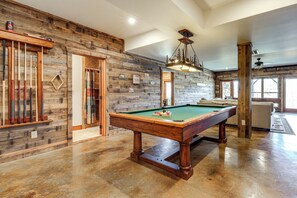 A pool table in a room with wooden walls and a polished floor. - Game Room + Deck: Spacious Spruce Pine Retreat! (Spruce Pine)