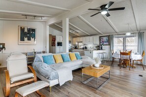 A spacious living area with a sofa, a rocking chair, and a dining table with chairs. - 3 Mi to Lake Powell! Desert Escape w/ Valley Views (Page)
