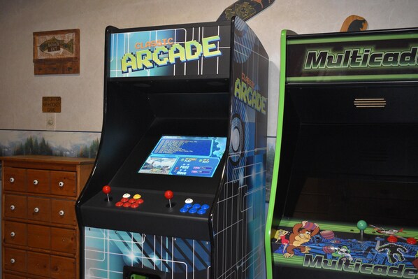 Two arcade machines labeled "Classic Arcade" and "Multicade" with control panels and screens. - Family Traditions (Sevierville)