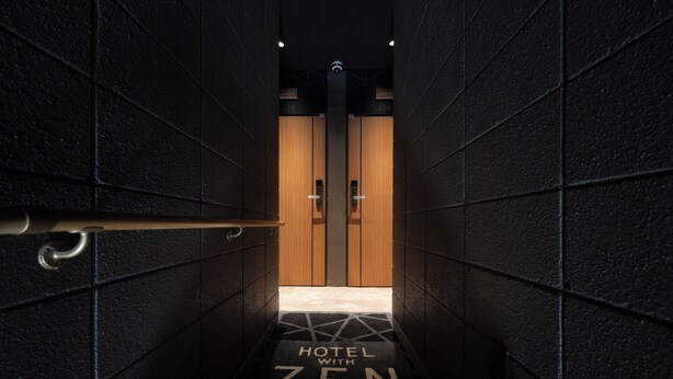 A hallway leading to a room with wooden doors, labeled "HOTEL WITH ZEN TIMELESS RESORT". - HOTEL ZEN narahourai (Nara)