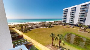 A resort with a beach view, a pool, and a multi-story building with balconies. - Mainsail 136 3 Bedroom Condo (Miramar Beach)
