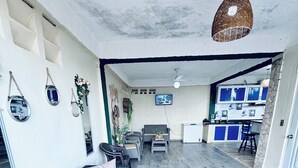 A spacious living area with a sofa, coffee table, and dining area. - Charming Villa with Atlantic Ocean view (Cabrera)