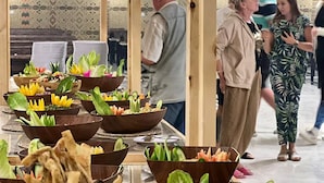 A buffet setup with various dishes and fresh vegetables. - Victoria Luxury Camp (Wadi Rum)
