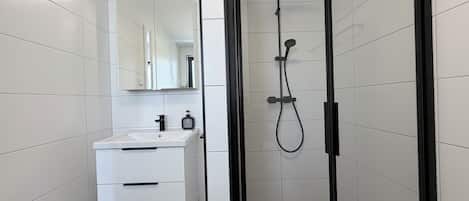 Shower, towels, soap, toilet paper