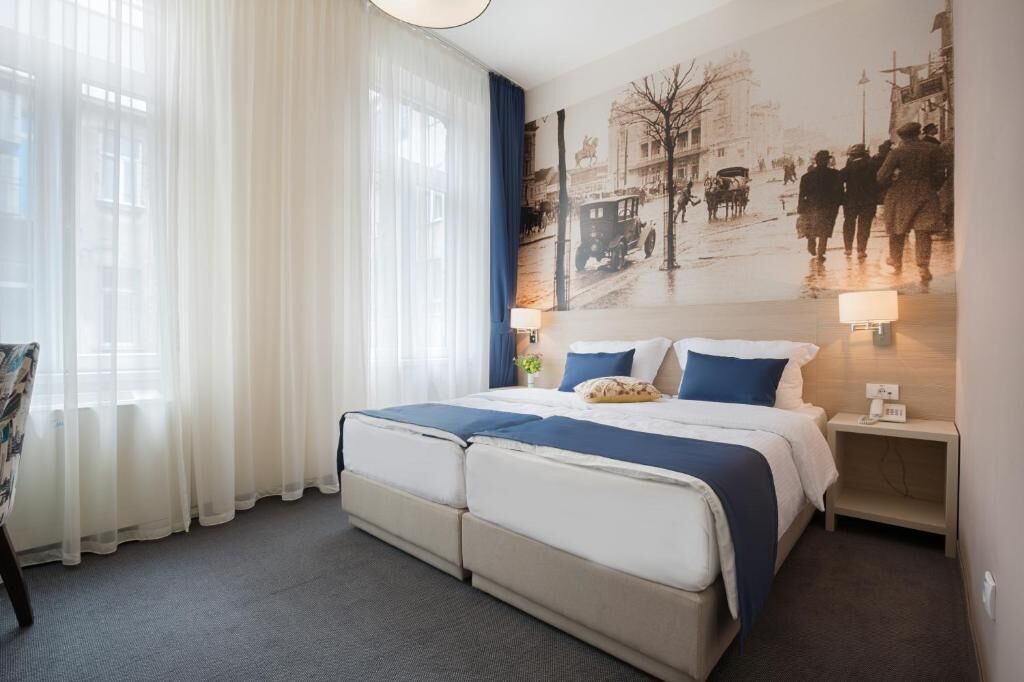 Standard Double or Twin Room, Courtyard View | In-room safe, laptop workspace, blackout drapes, iron/ironing board