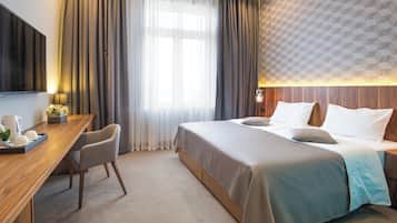 Deluxe Double or Twin Room, City View | In-room safe, laptop workspace, blackout curtains, iron/ironing board
