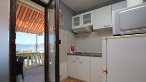 Fridge, microwave, cookware/dishes/utensils - One Bedroom Apartment (Slatine)