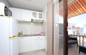 Fridge, microwave, cookware/dishes/utensils - One Bedroom Apartment (Slatine)