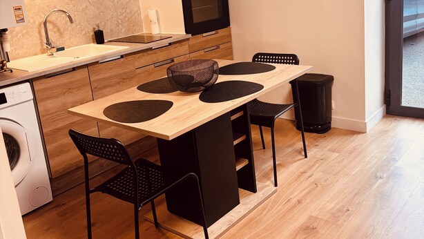 A compact kitchen with a wooden countertop, a built-in oven, and a microwave. - House 4/5 persons near Puy du Fou (Nueil-les-Aubiers)