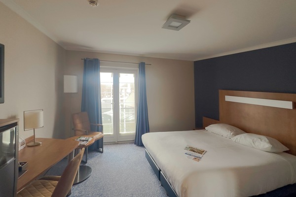 Breathe in fresh air with balcony doors and extra seating.