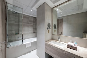 Superior Room, 1 King Bed | Bathroom | Rainfall showerhead, eco-friendly toiletries, hair dryer, slippers
