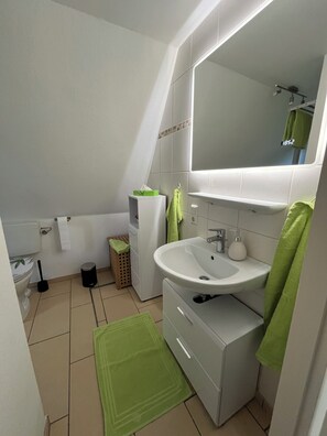 Shower, hair dryer, towels, soap