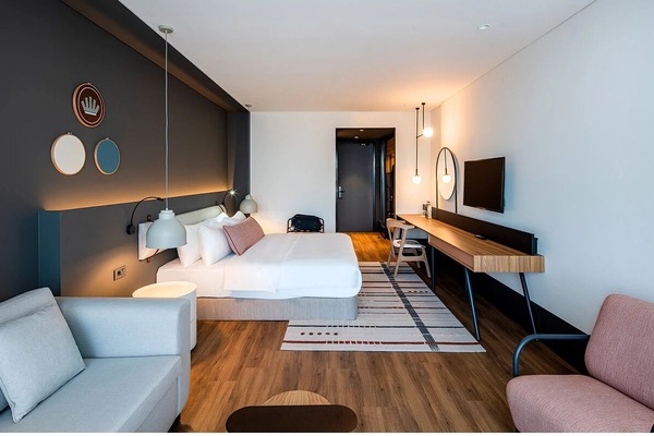 Stretch out in a spacious room with lounge seating and desk.