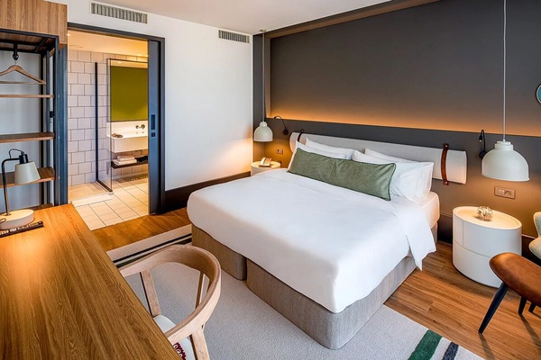 Wake refreshed in a stylish room with warm ambient lighting.