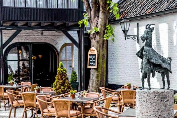 Linger outdoors beside sculptural accents and café-style tables.
