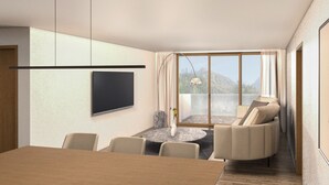 Un soggiorno moderno con TV a schermo piatto, un'area pranzo con tavolo e sedie in legno, un tavolino rotondo e un divano.