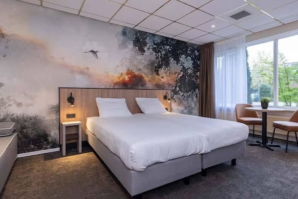 Unit with 2 Twin beds and 1 sofa bed. Exact unit will be assigned upon arrival. Views, colors, and decor may vary.