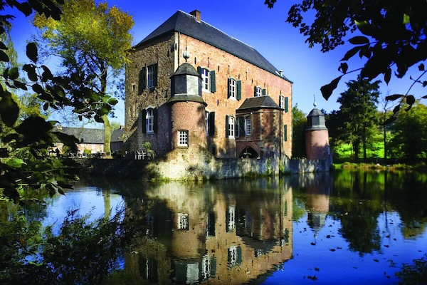 Lose yourself in fairytale castle views mirrored on the moat.