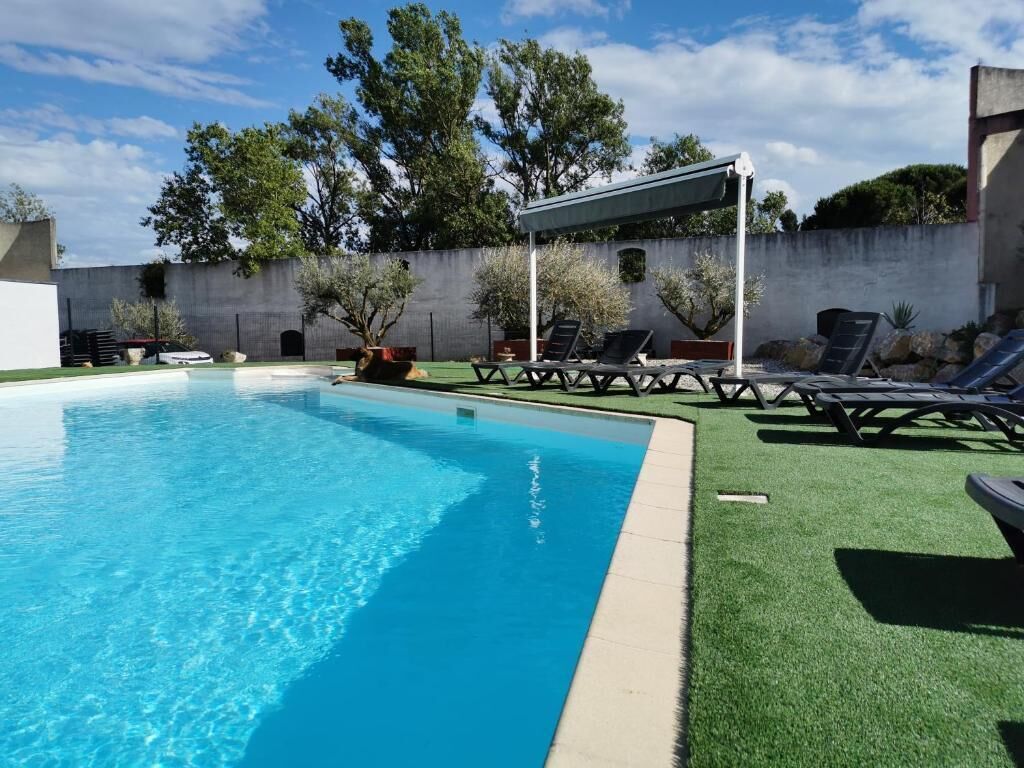 Seasonal outdoor pool, open 1:00 PM to 9:30 PM, pool umbrellas