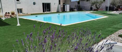 Seasonal outdoor pool, open 1:00 PM to 9:30 PM, pool umbrellas