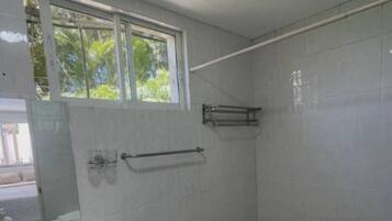 Shower, towels, soap, toilet paper