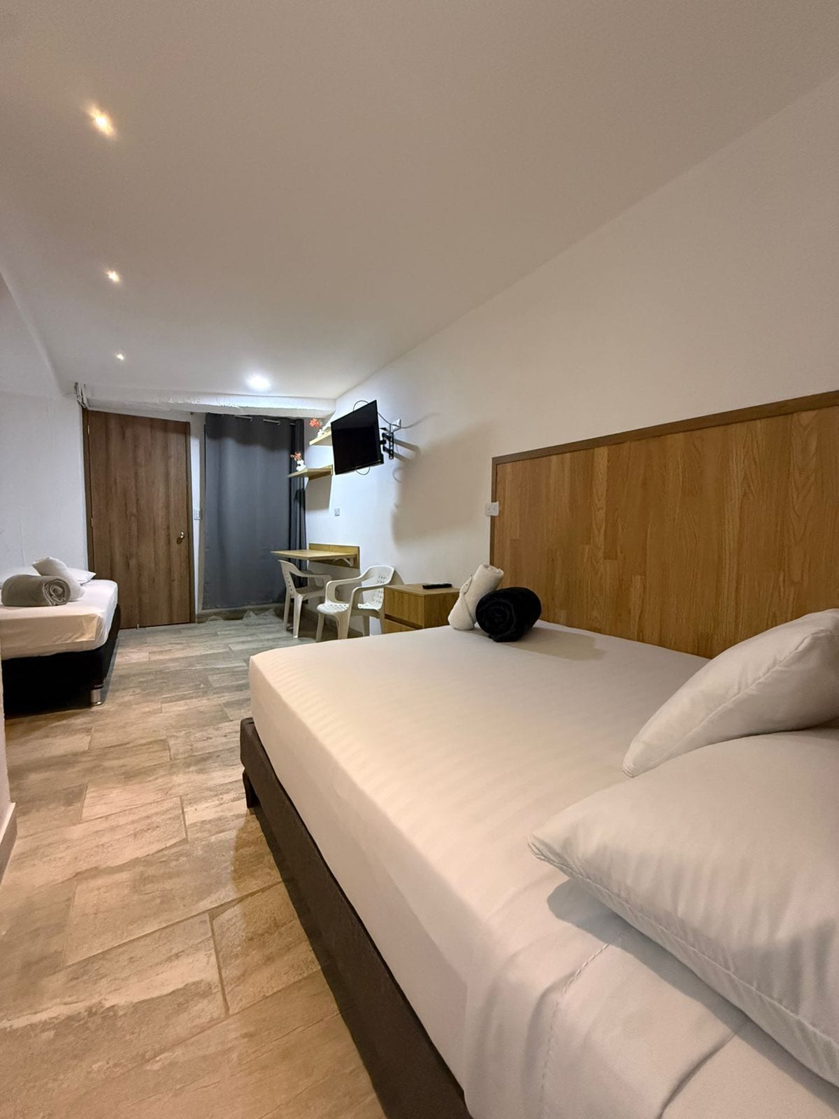 Classic Triple Room | Blackout drapes, iron/ironing board, free WiFi, bed sheets