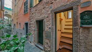 Unclassified image, 5 of 25, button - GuestHost - A cozy 100 square meters apartment, perfect for four people, located between the first and third floors of a typical Cinque Terre townhouse (NO elevator).The property, thanks to a large terrace, enjoys fantastic views of the sea and mountains (Riomaggiore)