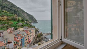 Unclassified image, 3 of 25, button - GuestHost - A cozy 100 square meters apartment, perfect for four people, located between the first and third floors of a typical Cinque Terre townhouse (NO elevator).The property, thanks to a large terrace, enjoys fantastic views of the sea and mountains (Riomaggiore)