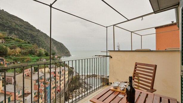 Unclassified image, 1 of 25, button - GuestHost - A cozy 100 square meters apartment, perfect for four people, located between the first and third floors of a typical Cinque Terre townhouse (NO elevator).The property, thanks to a large terrace, enjoys fantastic views of the sea and mountains (Riomaggiore)