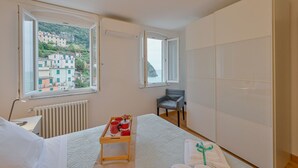 Unclassified image, 2 of 25, button - GuestHost - A cozy 100 square meters apartment, perfect for four people, located between the first and third floors of a typical Cinque Terre townhouse (NO elevator).The property, thanks to a large terrace, enjoys fantastic views of the sea and mountains (Riomaggiore)