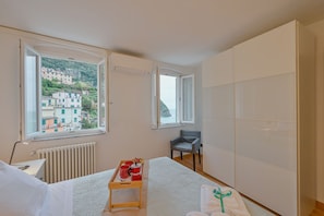 2 bedrooms, iron/ironing board - GuestHost - A cozy 100 square meters apartment, perfect for four people, located between the first and third floors of a typical Cinque Terre townhouse (NO elevator).The property, thanks to a large terrace, enjoys fantastic views of the sea and mountains (Riomaggiore)