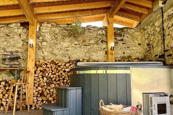 Our wood fired hot tub 2meter’s in diameter, plenty of room to stretch out , in a sheltered, private patio with a roof. Romantically decorated with fairy lights for late evenings !