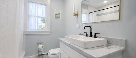 Shower, hair dryer, towels, soap