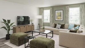 A living room with a sofa, ottomans, a coffee table, a TV, and a plant. - Masters Week Retreat (Grovetown)