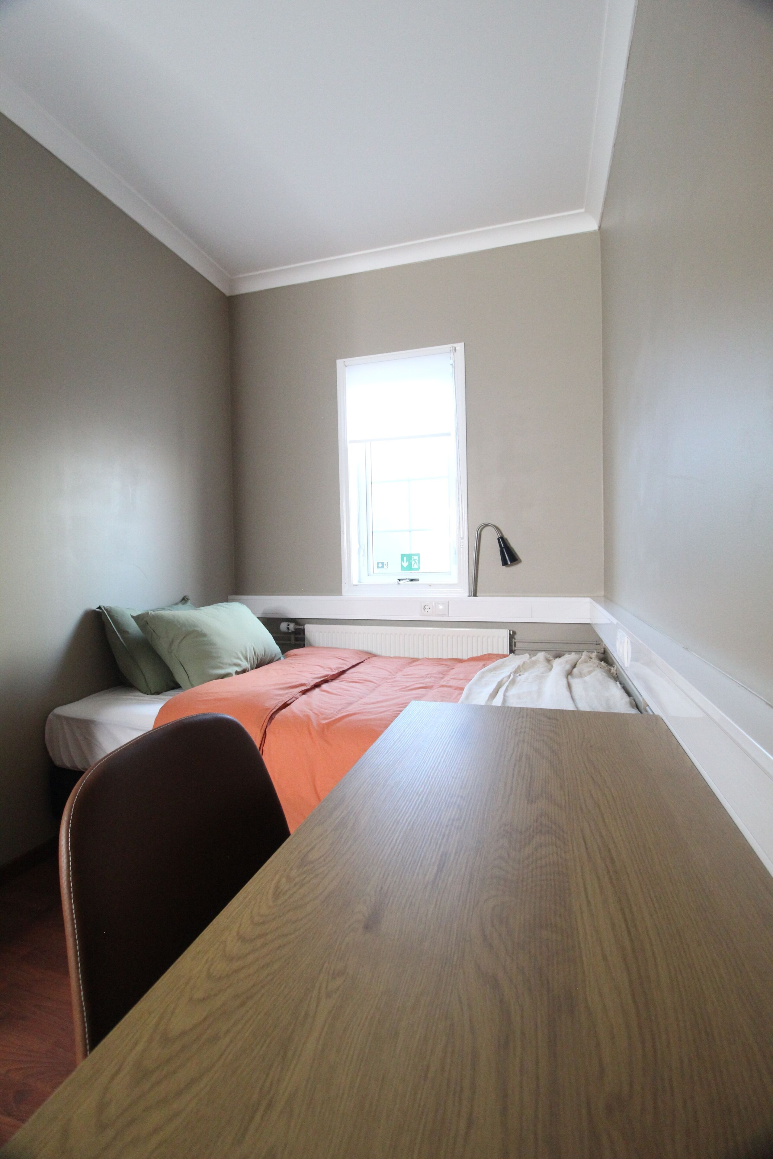 Hypo-allergenic bedding, desk, laptop workspace, blackout drapes