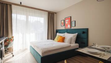 Select Comfort beds, desk, laptop workspace, blackout curtains