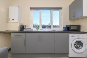 Fridge, microwave, toaster, dining tables